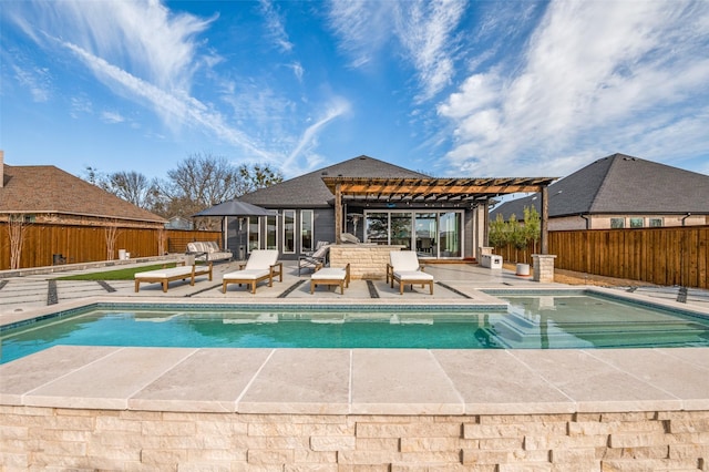 view of pool featuring a fenced backyard, a fenced in pool, a pergola, a patio area, and an exterior structure