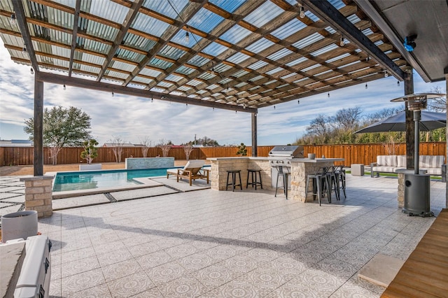 view of patio with a fenced in pool, a fenced backyard, outdoor dry bar, and a pergola