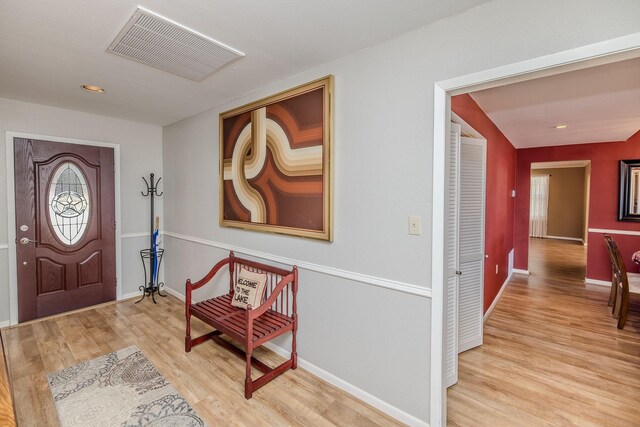 entryway with visible vents, recessed lighting, baseboards, and wood finished floors