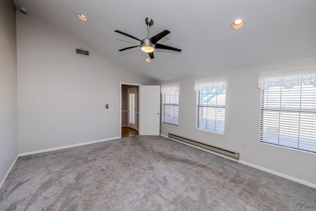 carpeted spare room featuring lofted ceiling, baseboards, visible vents, and baseboard heating