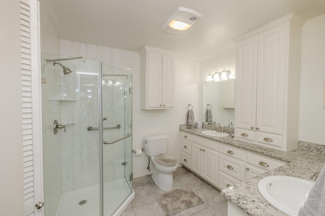 full bathroom with tile patterned flooring, toilet, a stall shower, and vanity