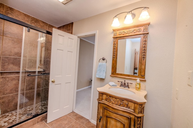 bathroom with vanity and a shower stall