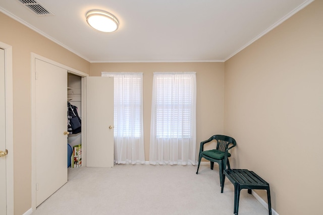 living area featuring carpet, visible vents, and ornamental molding