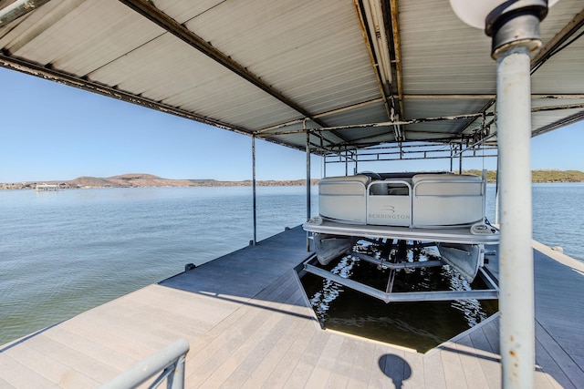 view of dock with a water view and boat lift