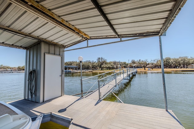 dock area with a water view