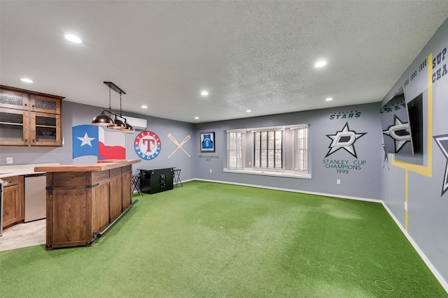 interior space featuring recessed lighting, baseboards, light colored carpet, and a textured ceiling