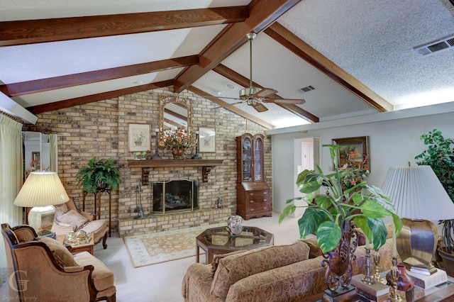 living area featuring visible vents, a ceiling fan, vaulted ceiling with beams, and a fireplace