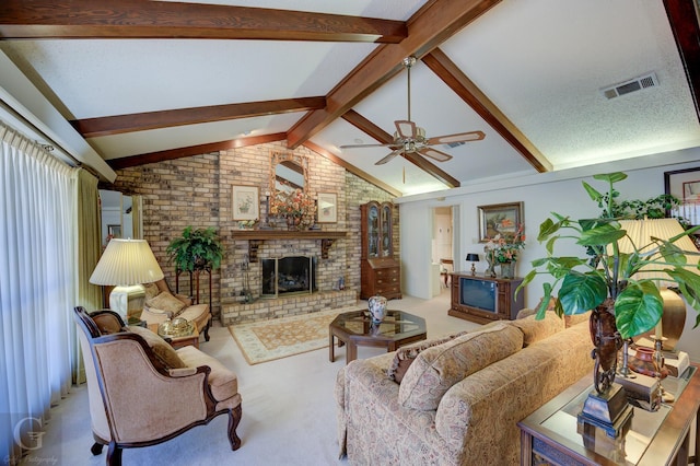 carpeted living room with visible vents, brick wall, vaulted ceiling with beams, ceiling fan, and a fireplace