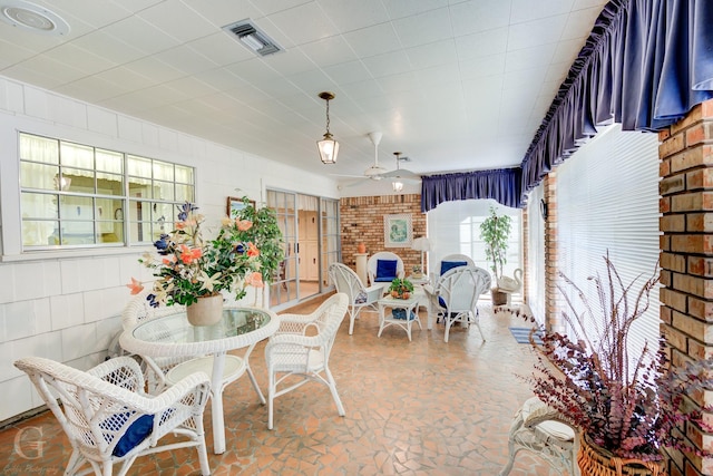 view of patio with visible vents, outdoor dining space, and a ceiling fan