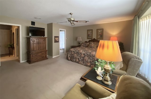 bedroom with baseboards, carpet, and a ceiling fan