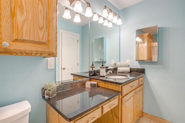 399 Brindley Rd, Maypearl, TX 76064 - bathroom featuring vanity, toilet, and tile patterned flooring