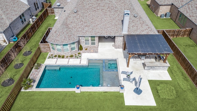 view of swimming pool with a fenced backyard, a lawn, a fenced in pool, and a patio