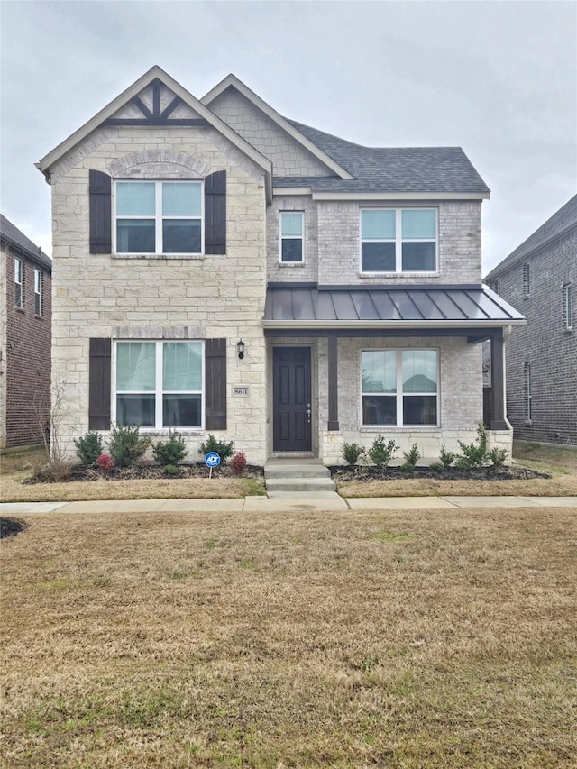 craftsman inspired home with metal roof, a shingled roof, brick siding, a standing seam roof, and a front yard