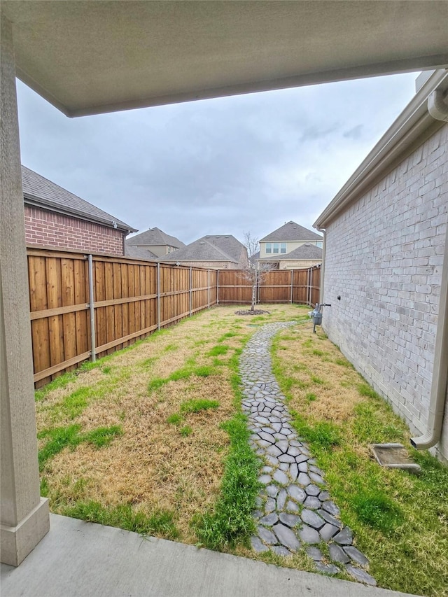 view of yard featuring a fenced backyard