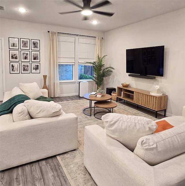 living room with recessed lighting, visible vents, ceiling fan, wood finished floors, and baseboards