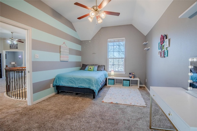 bedroom with baseboards, lofted ceiling, a ceiling fan, and carpet flooring