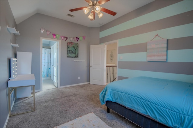 carpeted bedroom featuring visible vents, connected bathroom, baseboards, ceiling fan, and vaulted ceiling