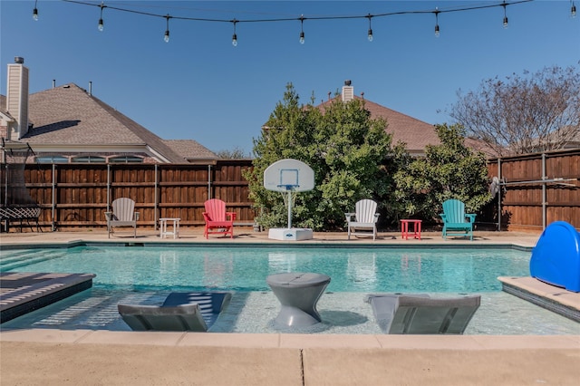 view of pool featuring a fenced in pool, a patio, and a fenced backyard