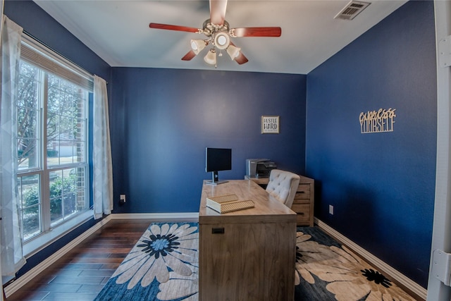 office area with a wealth of natural light, visible vents, and baseboards