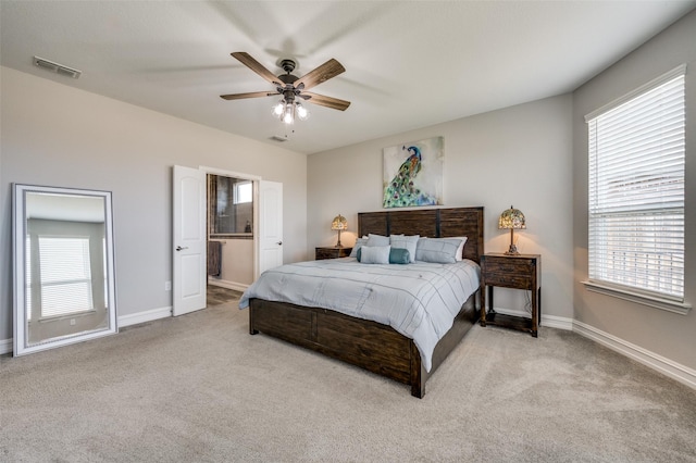 1121 Ash St, Celina, TX 75009 - carpeted bedroom featuring a ceiling fan, connected bathroom, visible vents, and baseboards