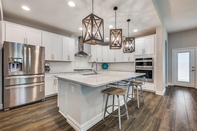 1121 Ash St, Celina, TX 75009 - kitchen featuring a sink, appliances with stainless steel finishes, wall chimney range hood, and dark wood finished floors