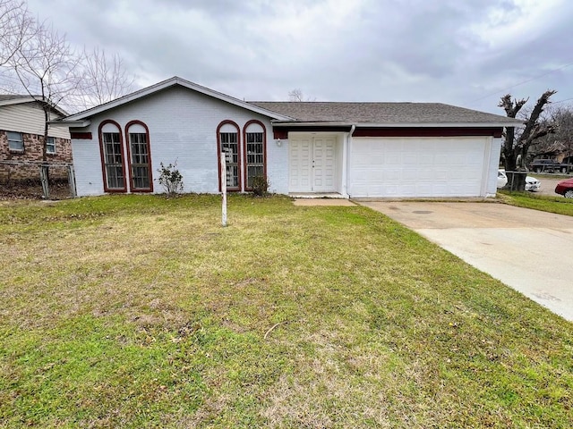 single story home featuring concrete driveway, brick siding, an attached garage, and a front yard