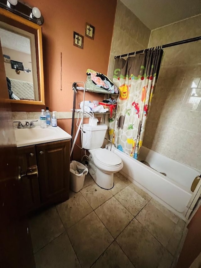 full bathroom featuring shower / tub combo, vanity, toilet, and tile patterned floors