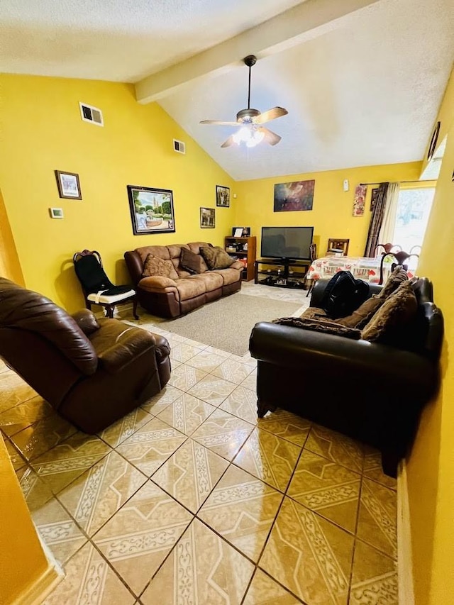 living room with vaulted ceiling with beams, visible vents, a ceiling fan, light tile patterned flooring, and a textured ceiling