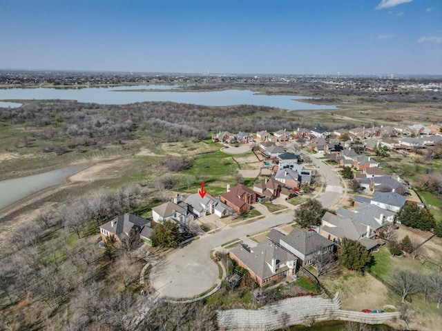 bird's eye view featuring a residential view and a water view