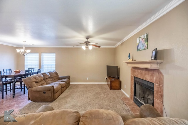 living room featuring carpet floors, baseboards, a fireplace, and ornamental molding