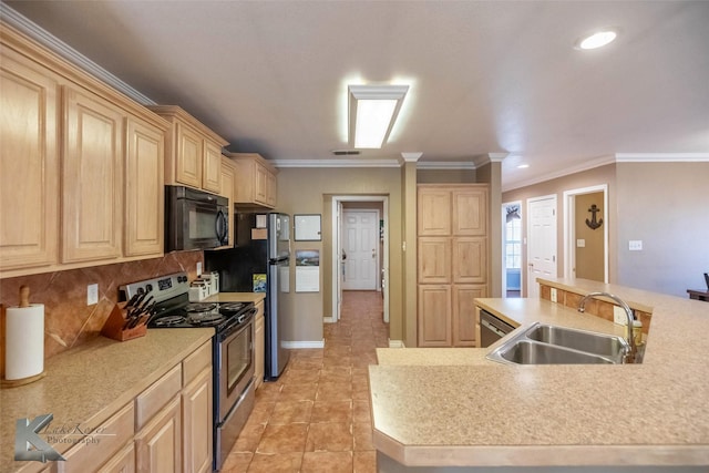 kitchen featuring light countertops, stainless steel range with electric stovetop, light brown cabinets, black microwave, and a sink