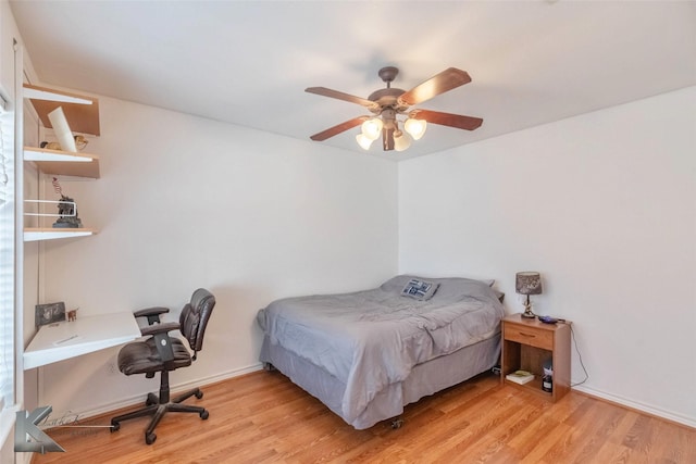 bedroom featuring light wood-type flooring and a ceiling fan