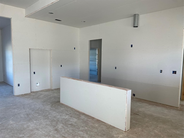 empty room featuring concrete floors