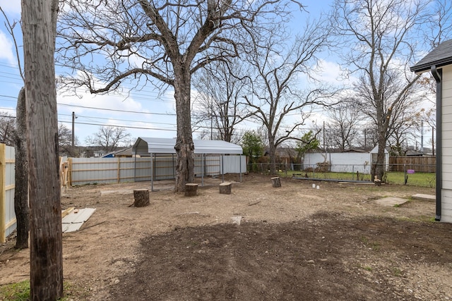 view of yard with an outdoor structure and a fenced backyard