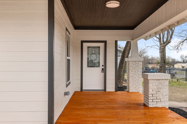 view of exterior entry with fence