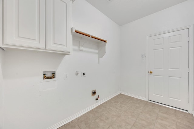 laundry room featuring gas dryer hookup, hookup for a washing machine, hookup for an electric dryer, baseboards, and cabinet space