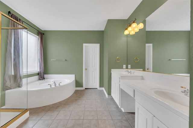 full bath with double vanity, a sink, a bath, and tile patterned floors