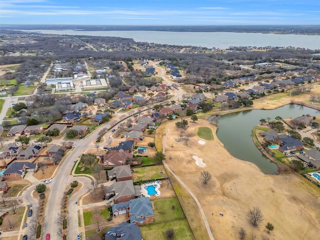 bird's eye view with a residential view and a water view