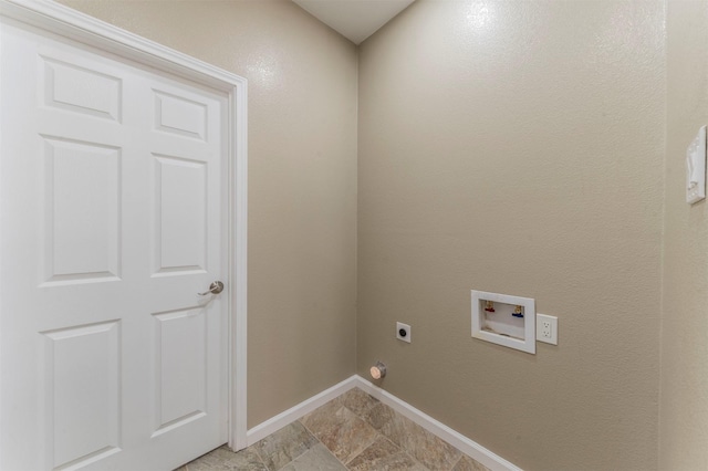 washroom with hookup for an electric dryer, laundry area, washer hookup, baseboards, and stone finish floor