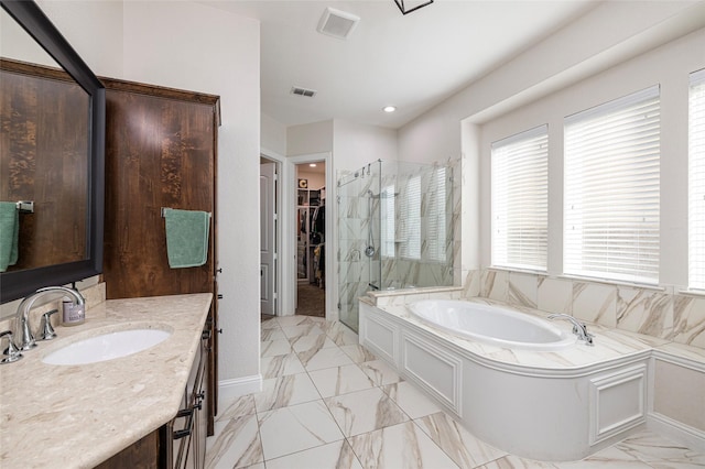 full bathroom with visible vents, marble finish floor, a spacious closet, a bath, and a stall shower