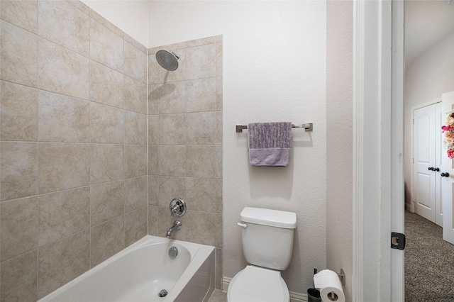 bathroom featuring bathing tub / shower combination and toilet