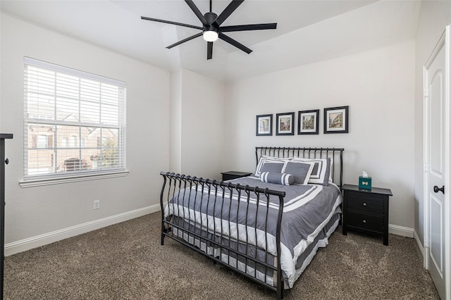 carpeted bedroom featuring a ceiling fan and baseboards