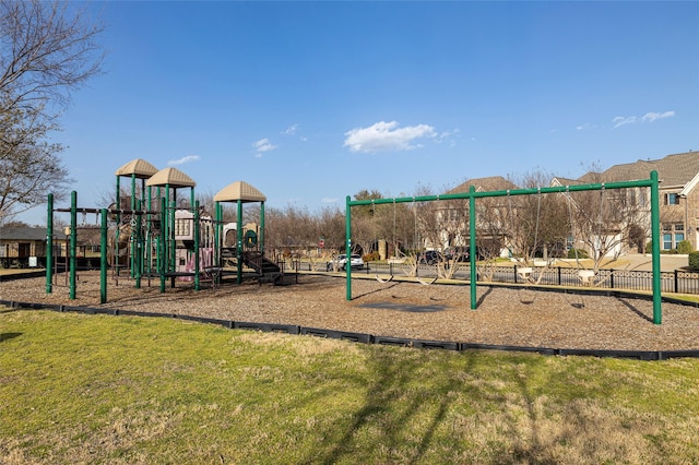 communal playground featuring a yard