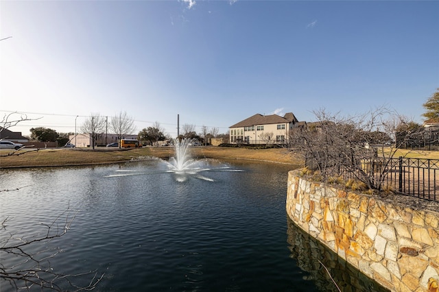 view of water feature with fence