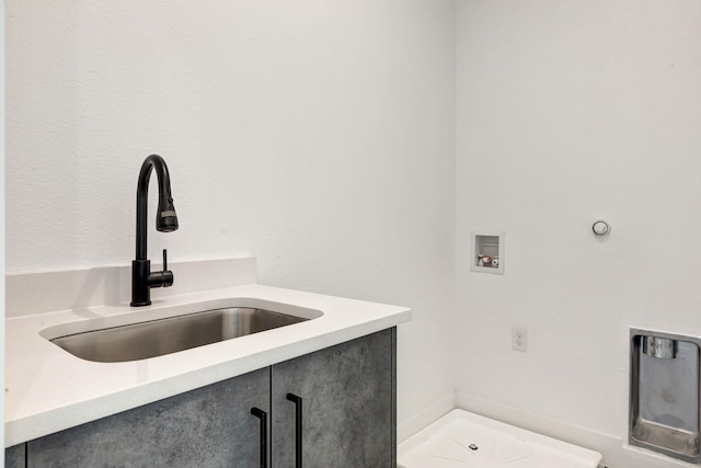 laundry area featuring a sink, cabinet space, and hookup for a washing machine