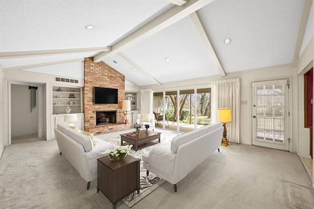 living area with visible vents, light colored carpet, lofted ceiling with beams, a textured ceiling, and a brick fireplace