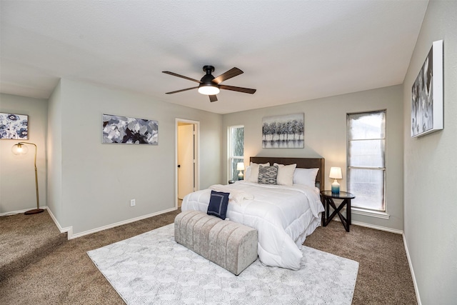 bedroom with carpet floors, ceiling fan, and baseboards