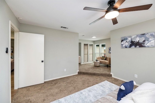 bedroom with a ceiling fan, carpet, visible vents, and baseboards