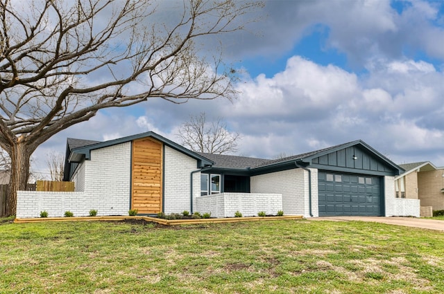 view of front of house featuring board and batten siding, concrete driveway, brick siding, and an attached garage