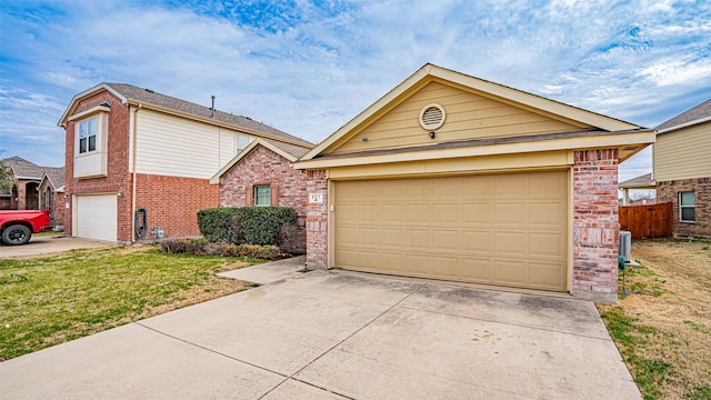 view of front of house with a front yard, fence, central AC unit, and brick siding